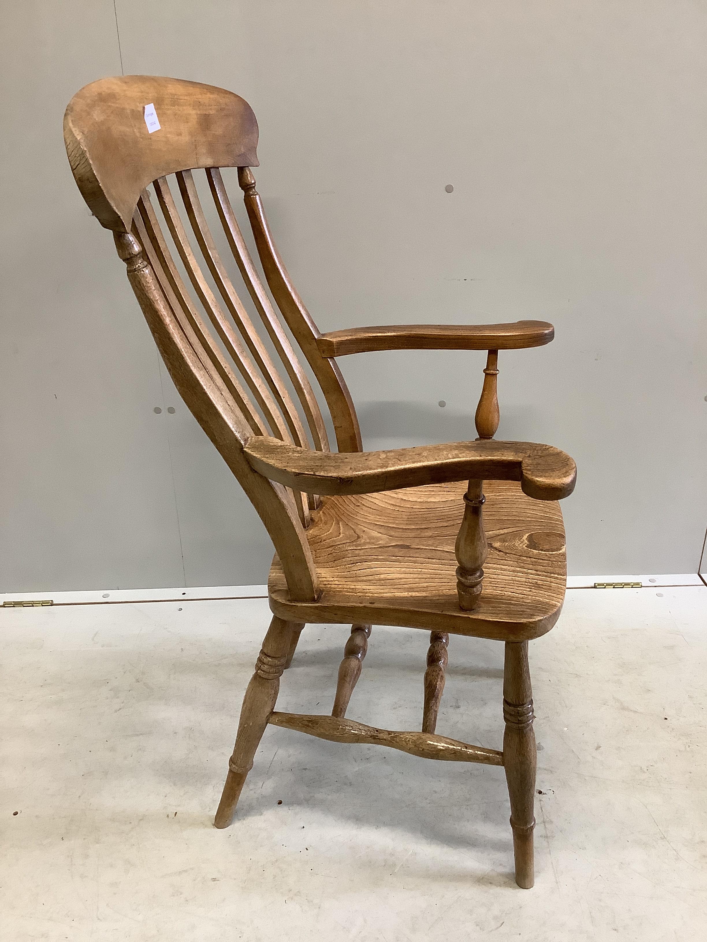 A Victorian elm and beech Windsor lathe back armchair, width 62cm, depth 43cm, height 112cm